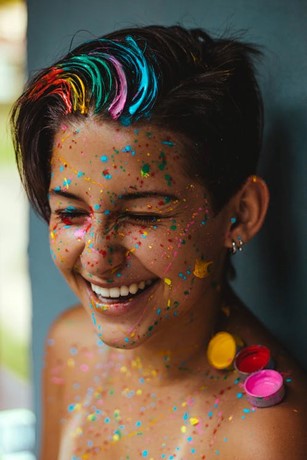“Shallow Focus Photo Of Woman Smiling With Face Paint“ by Vitória Santos from Pexels: https://www.pexels.com/photo/shallow-focus-photo-of-woman-smiling-with-face-paint-1882309/
